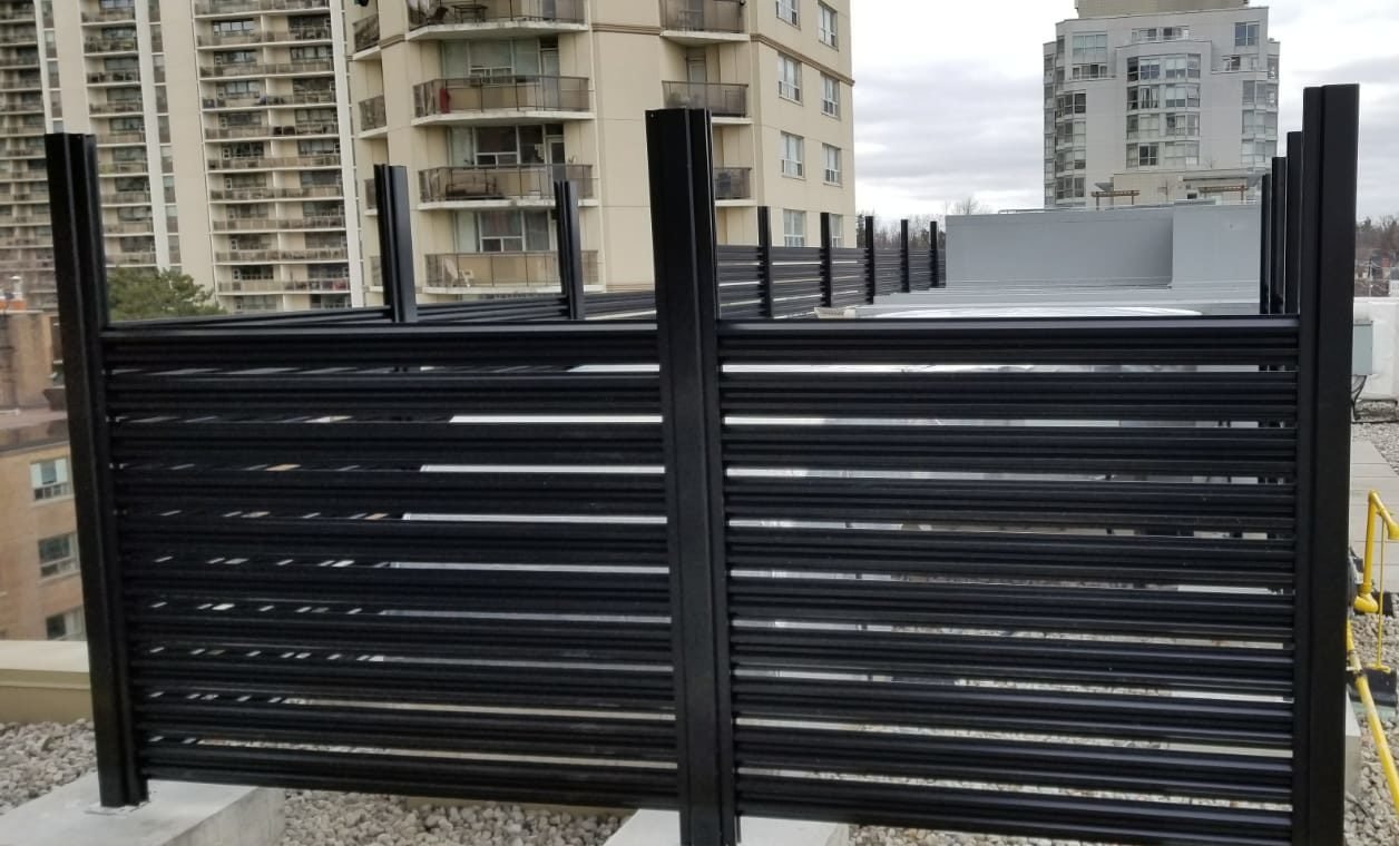 Commercial semi privacy aluminum fence for rooftop generator screening