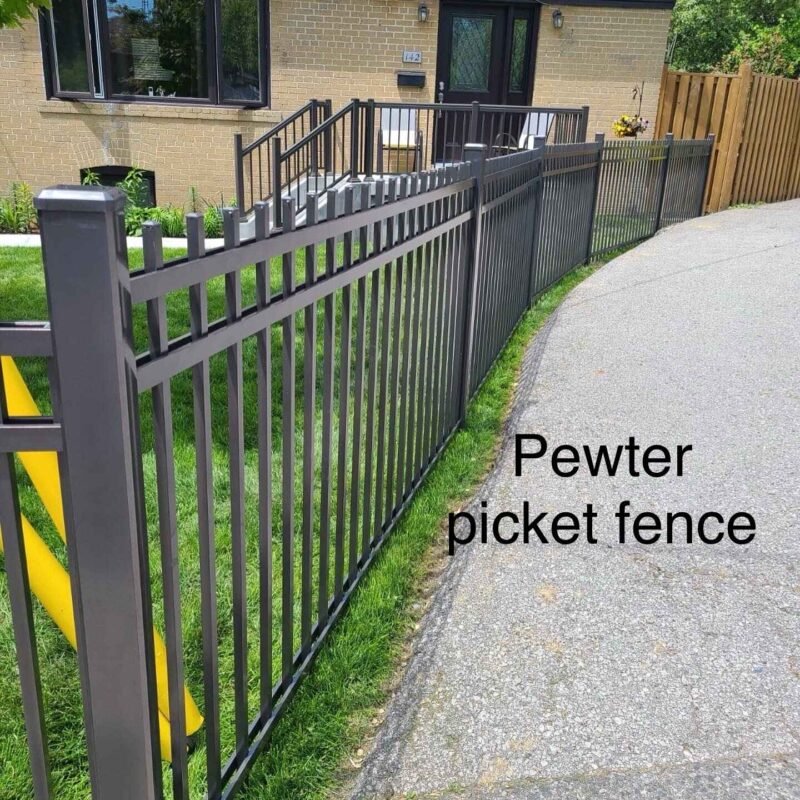 Pewter aluminum picket fence installed beside driveway