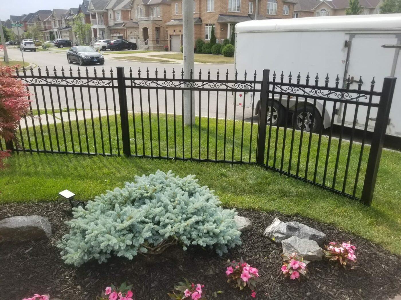 Ornamental aluminum picket fence style with decorative finial tops