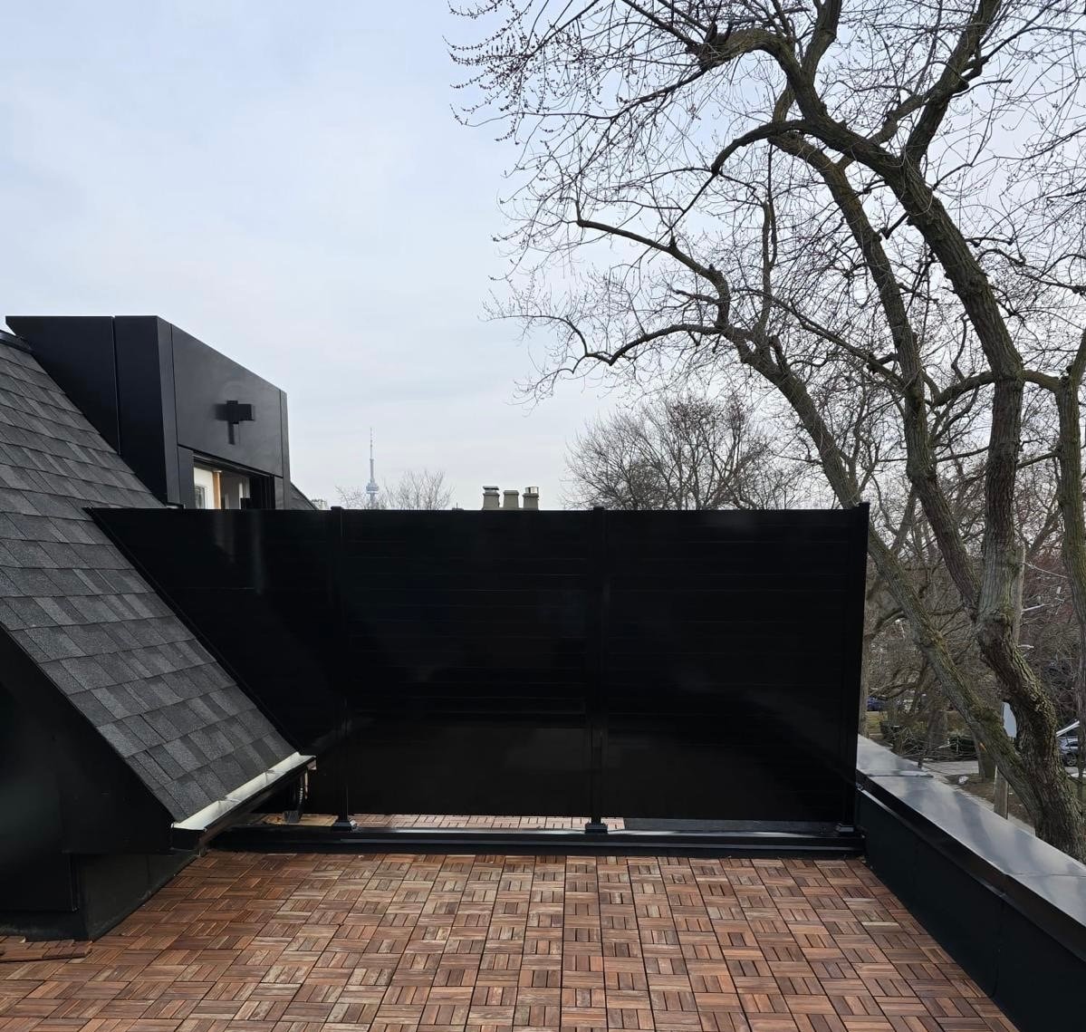Black aluminum horizontal slat fence panel with modern privacy design